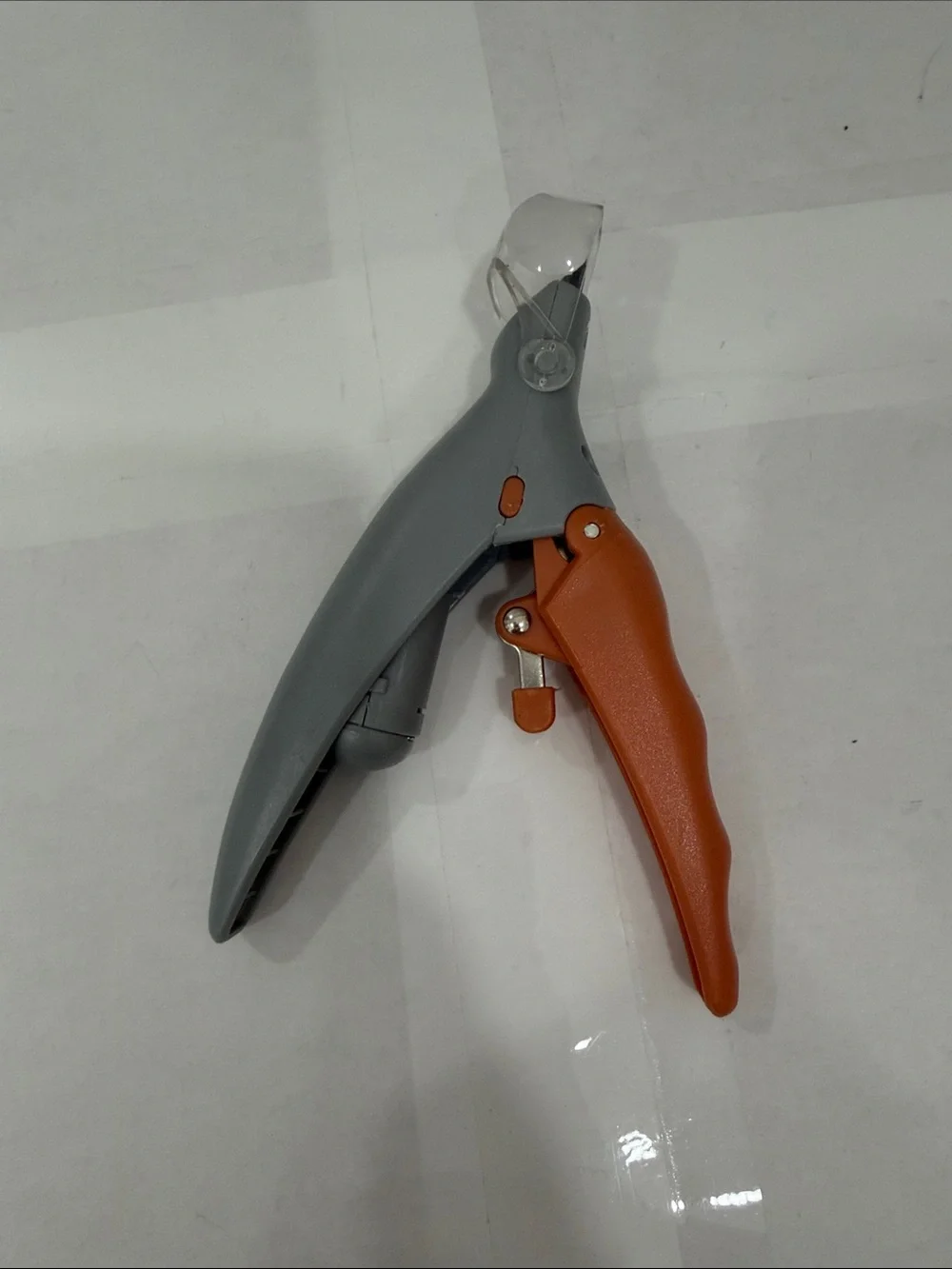 Gray and Orange Plastics Dog and Cat Nail Clippers that lights up.
